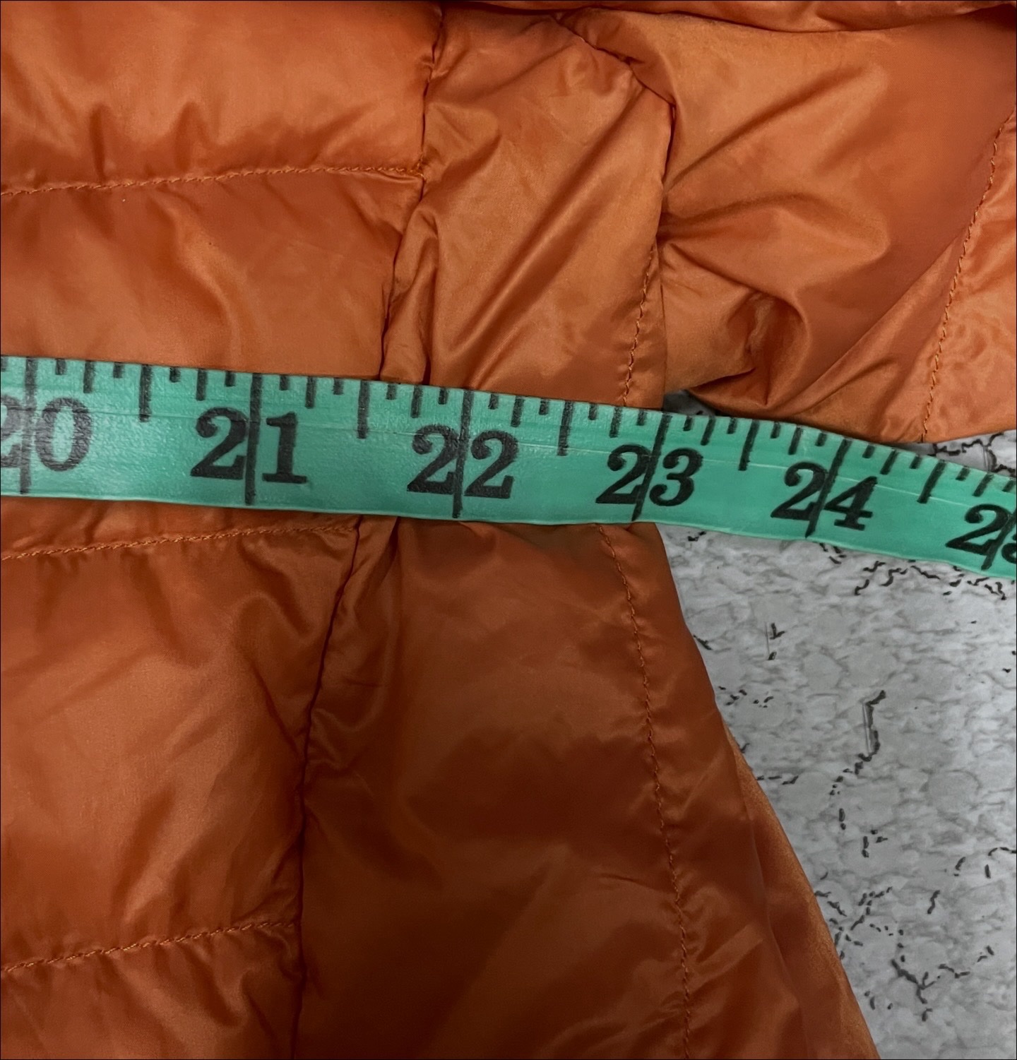 Uniqlo Orange Puffer Jacket detail view