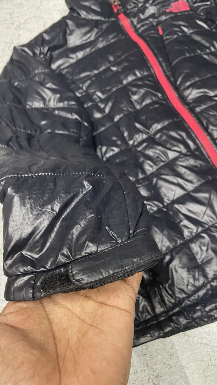 The North Face Black Puffer Jacket detail view