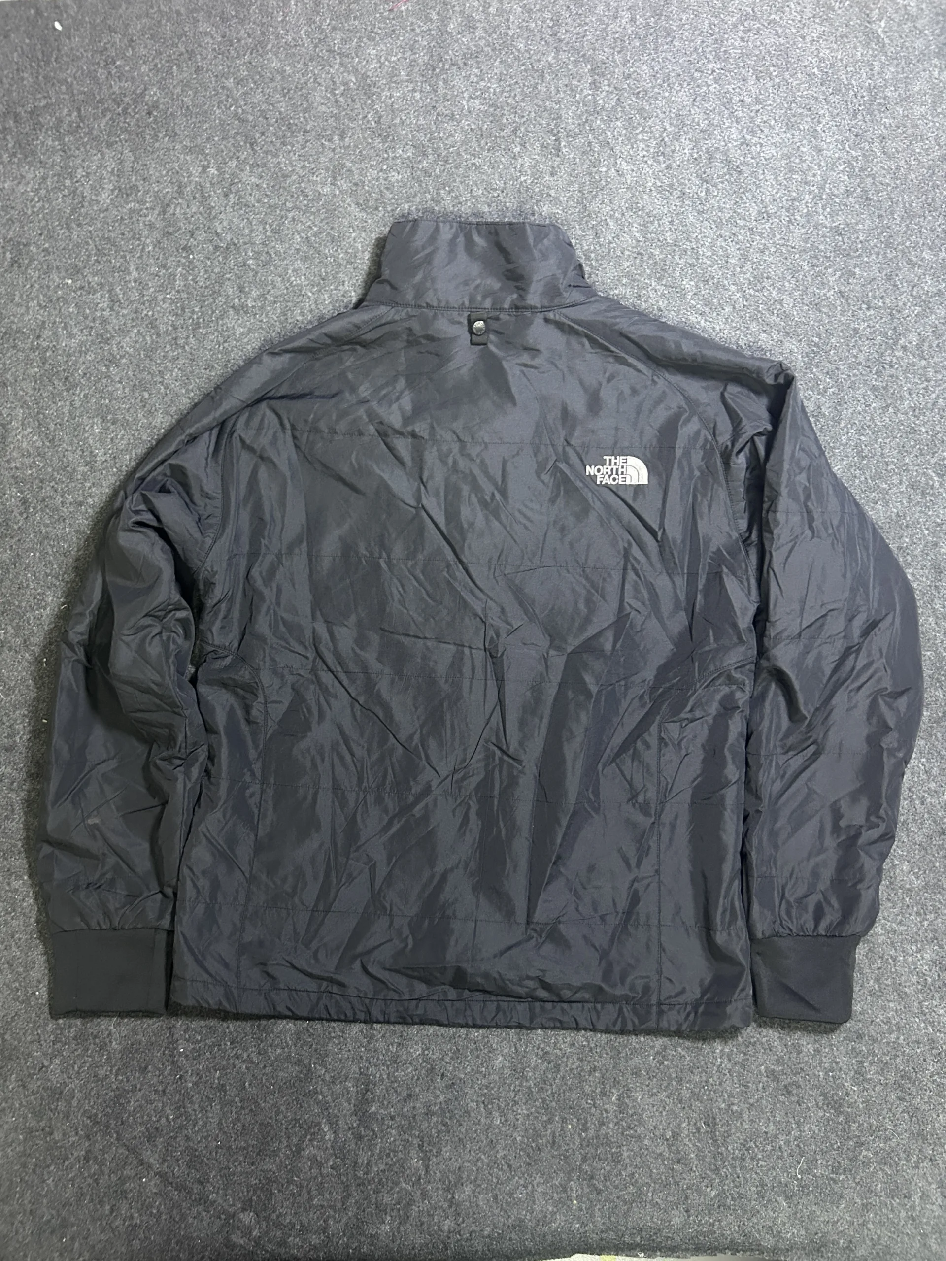 The North Face Black Puffer Jacket detail view
