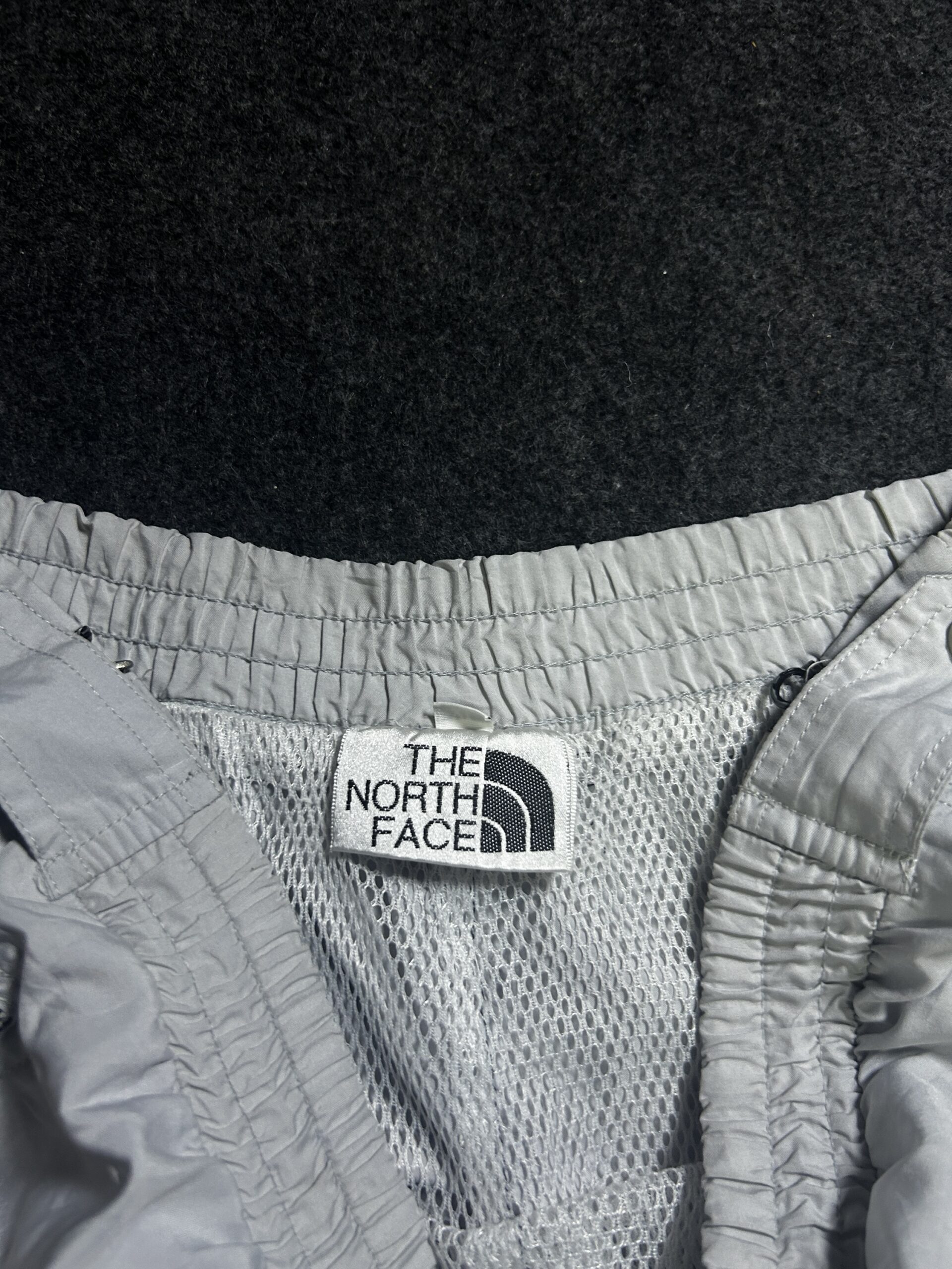 The North Face Grey Windbreaker Jacket detail view