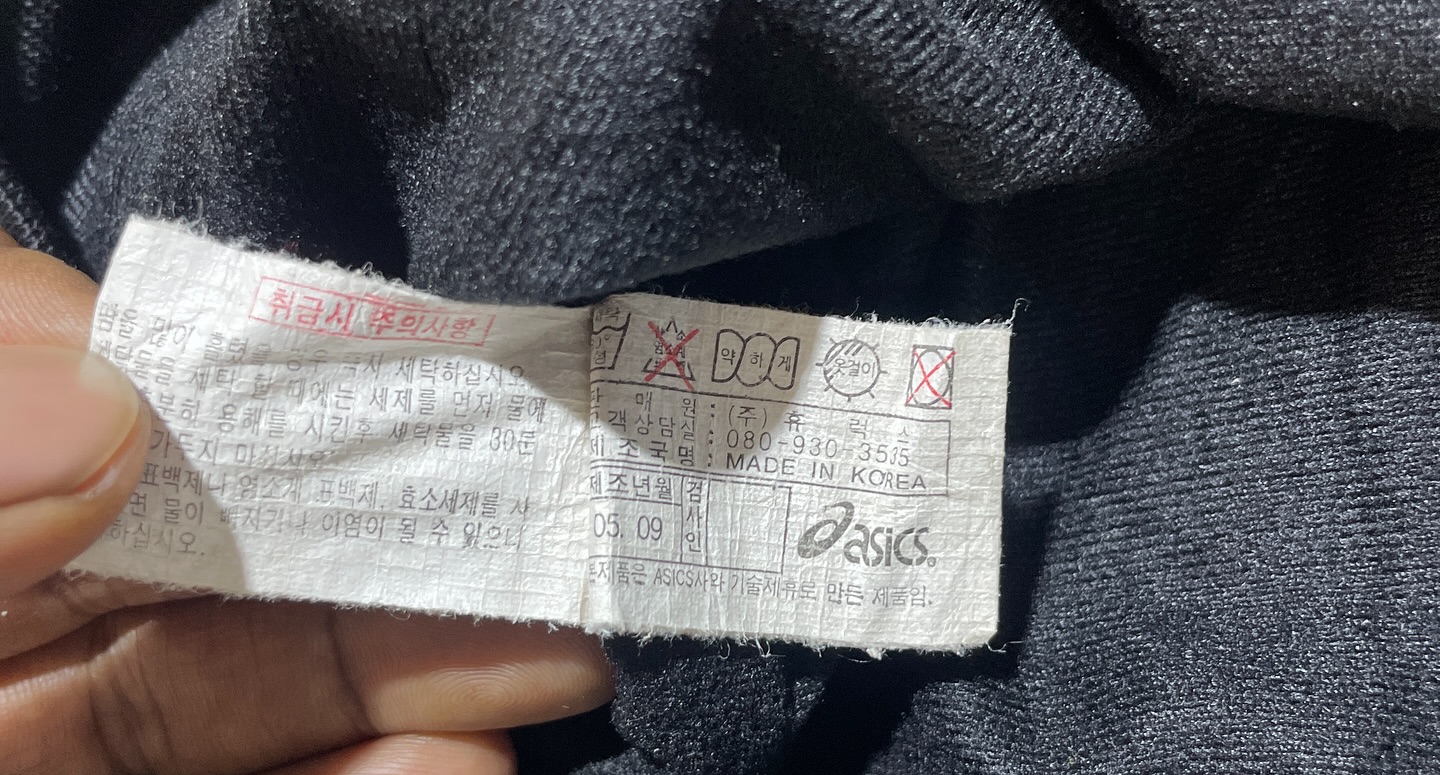 Asics Black Track Jacket detail view