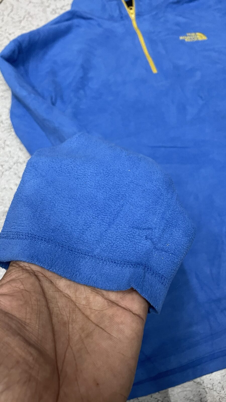 The North Face Blue Sweater detail view