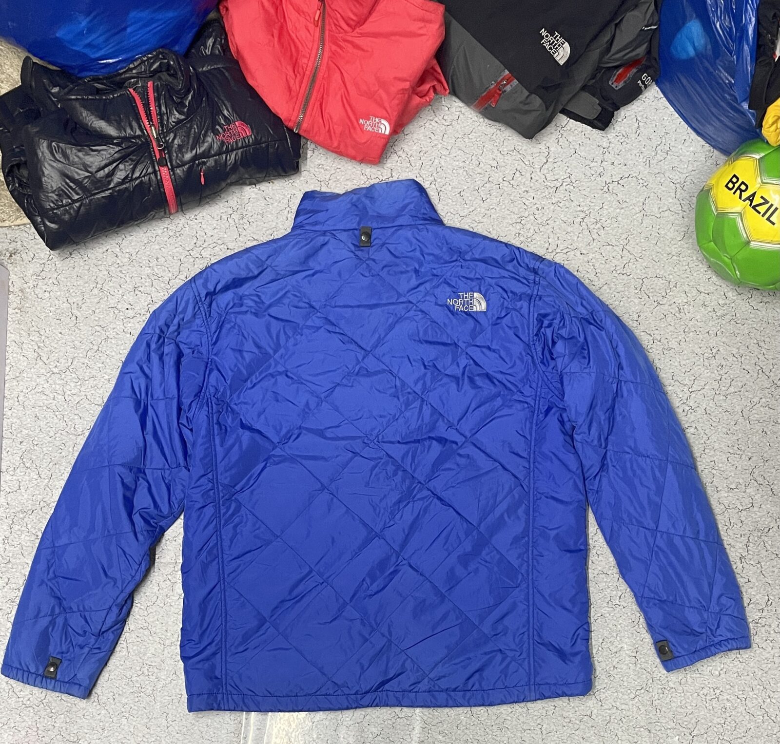 The North Face Blue Puffer Jacket detail view