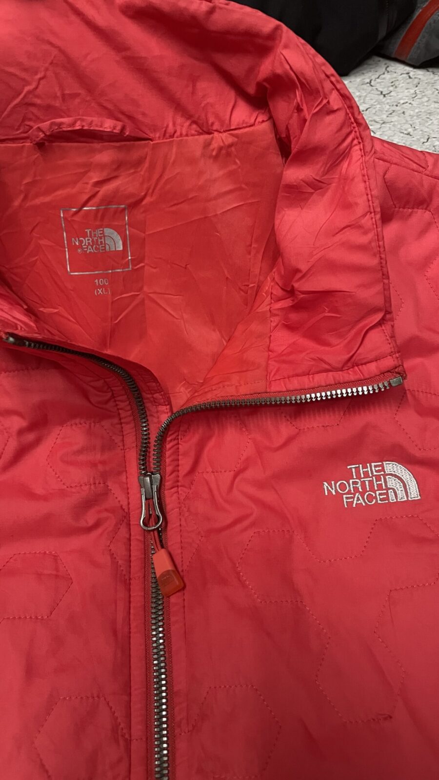The North Face Red Puffer Jacket detail view