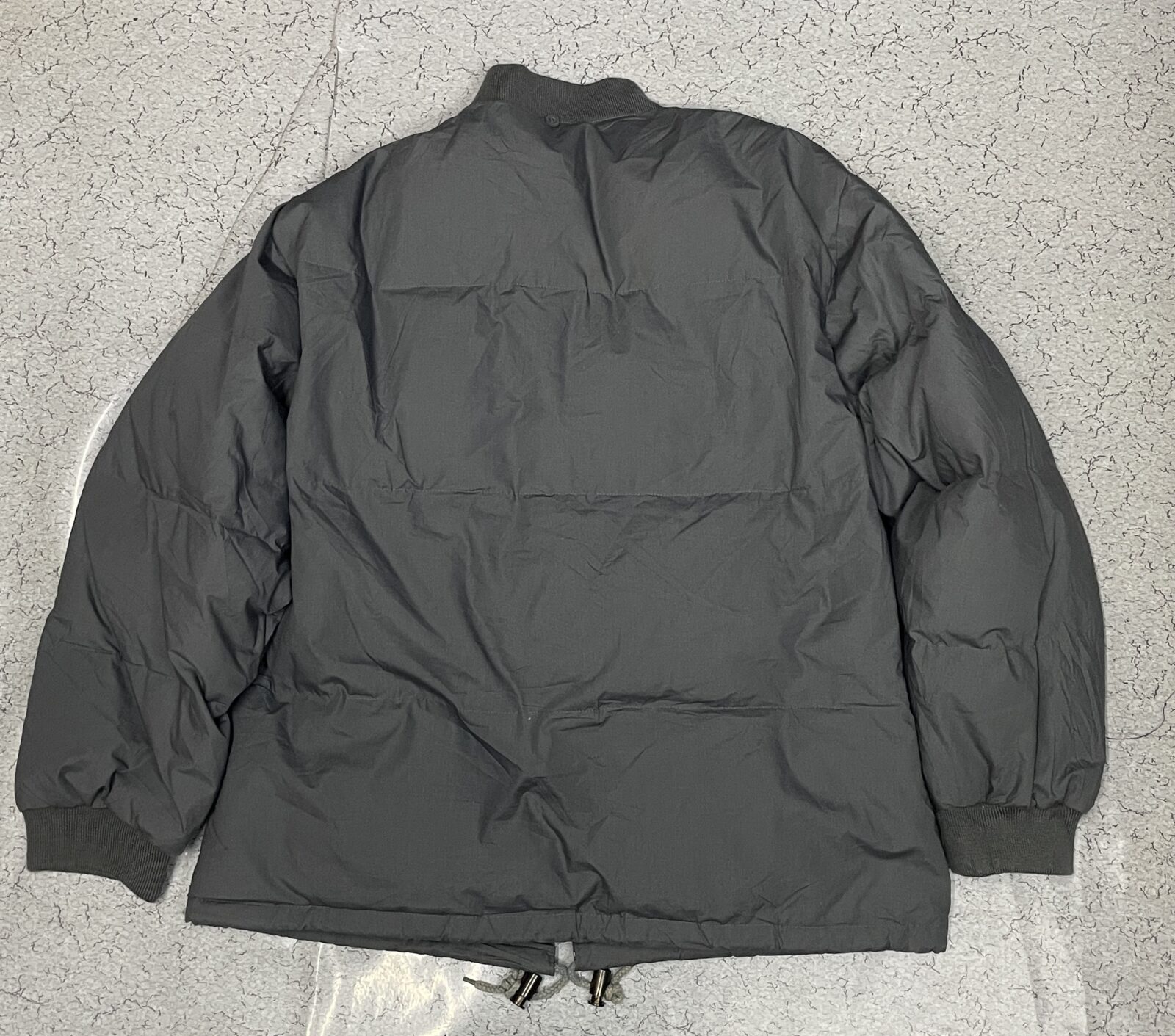 Asics Grey Puffer Jacket back view