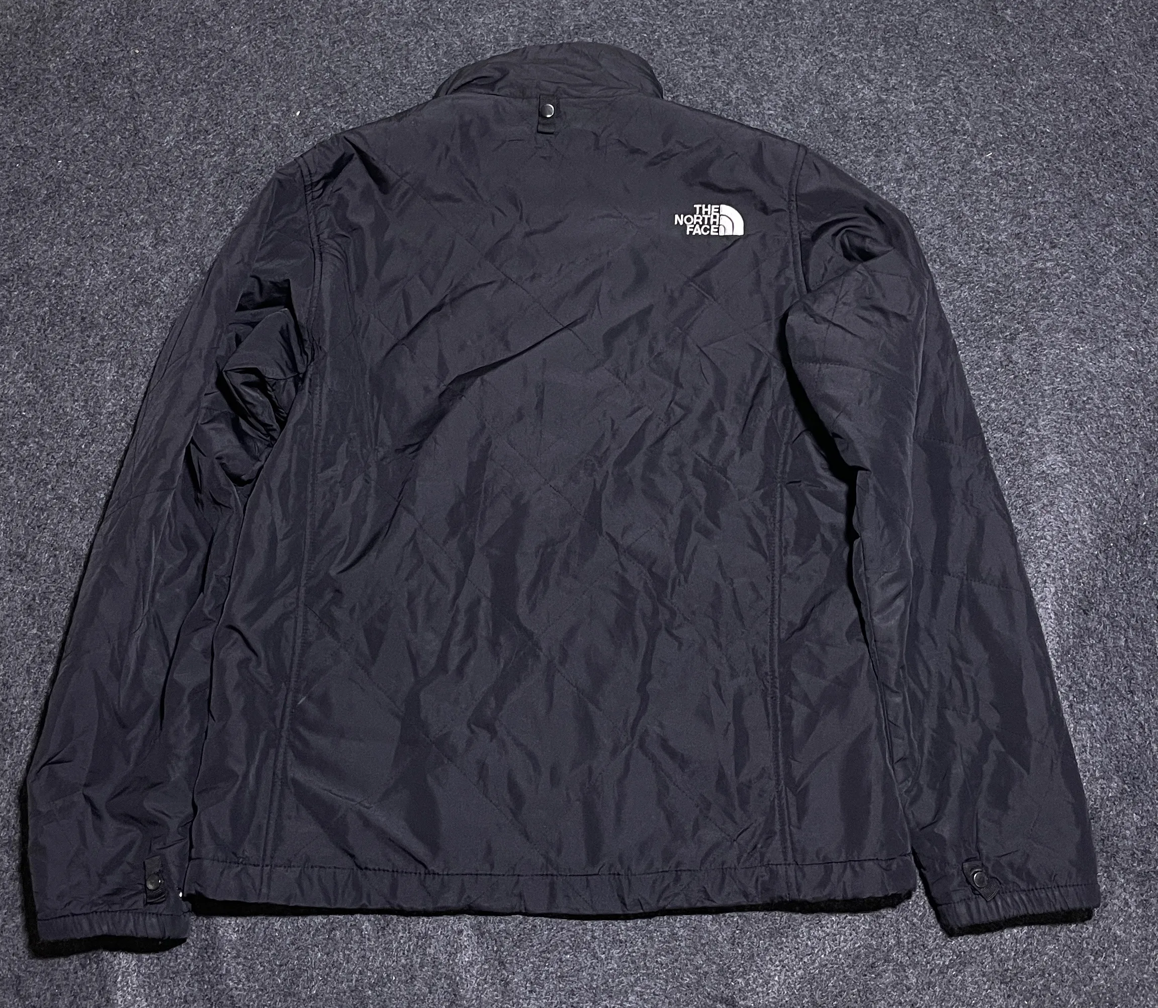 The North Face Black Puffer Jacket detail view