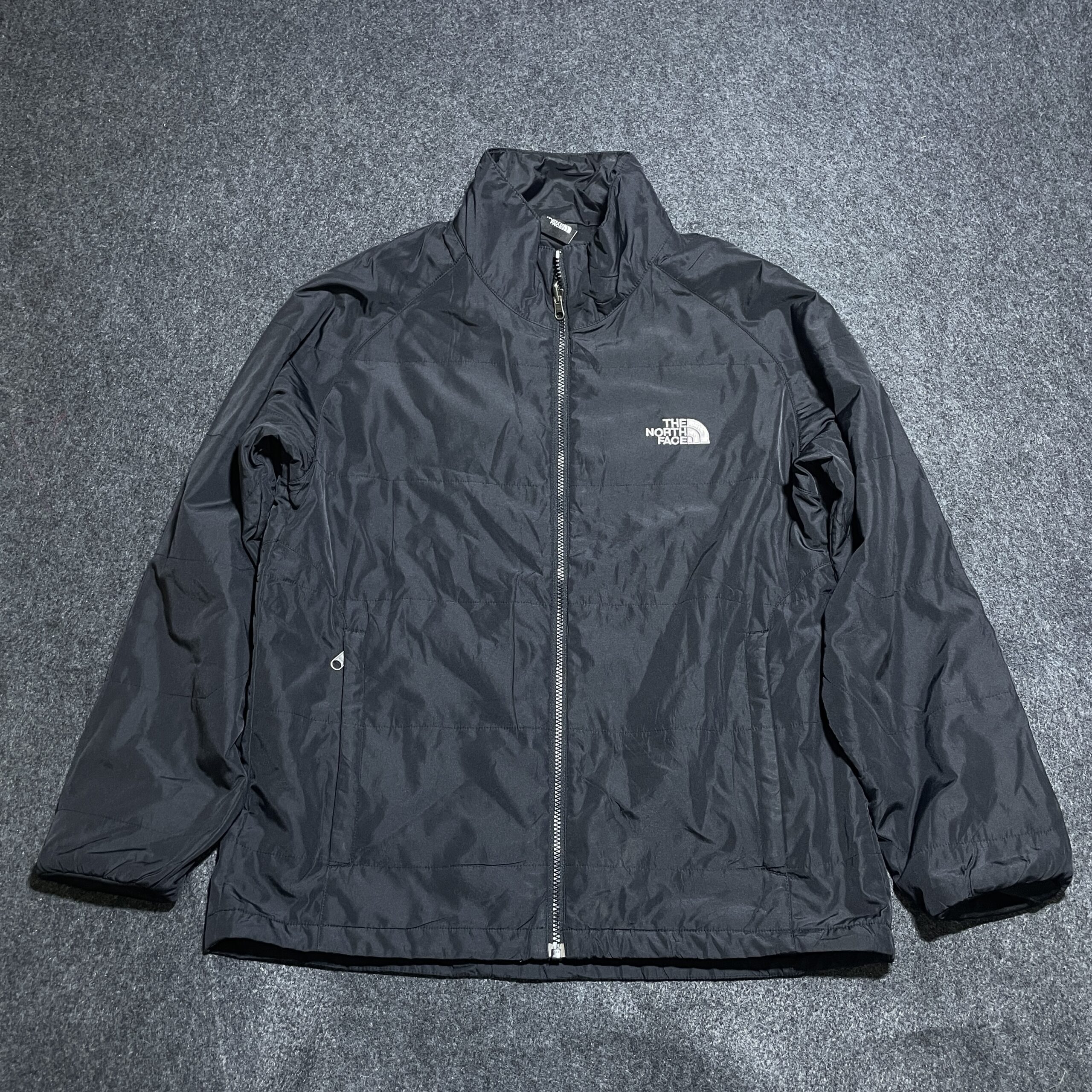 The North Face Black Puffer Jacket detail view